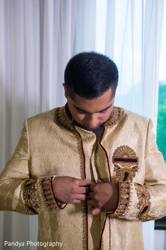 Indian groom in a beautiful beige sherwani. Indian groom in a beautiful beige sherwani.
