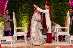 Lovely indian couple exchanging jaimalas Lovely indian couple exchanging jaimalas