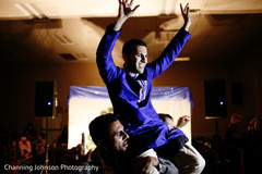 Indian groom carried by guests at the sangeet. Indian groom carried by guests at the sangeet.
