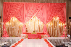Stunning candelabras lighting the stage mandap. Stunning candelabras lighting the stage mandap.