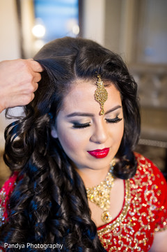 Indian bride getting her hair done. Indian bride getting her hair done.