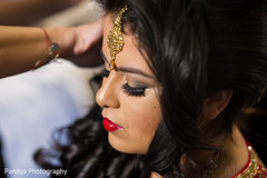 Indian bride getting her makeup and hair done for her big day. Indian bride getting her makeup and hair done for her big day.