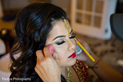Indian bride getting her makeup done. Indian bride getting her makeup done.