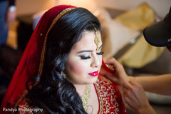 Bride getting the final touch ups. Bride getting the final touch ups.