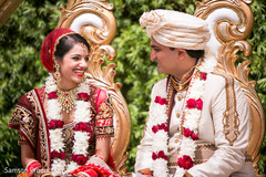Indian couple smiling at wedding ceremony Indian couple smiling at wedding ceremony