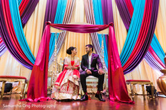 Beautiful indian couple in a traditional jhoola swing. Beautiful indian couple in a traditional jhoola swing.