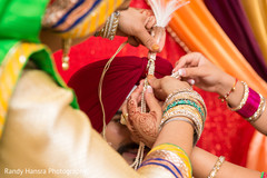 Final touch ups to the groom's turban. Final touch ups to the groom's turban.