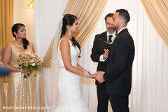 Indian couple holding hands at wedding ceremony Indian couple holding hands at wedding ceremony