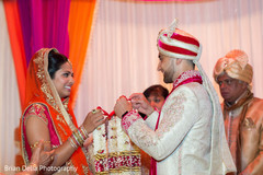 Indian couple exchanging jaimalas at wedding ceremony Indian couple exchanging jaimalas at wedding ceremony