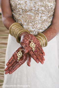 Indian bride showing her earrings and mehndi art indian wedding photography,indian bridal mehndi,indian wedding henna