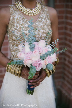 Indian bride holding her bouquet indian bridal bouquet,indian wedding ceremony floral and decor,indian bridal lengha