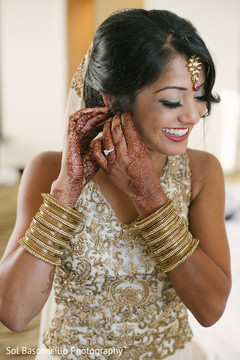 Indian bride getting ready for wedding ceremony indian bridal lengha,indian bride hair and makeup,bridal tikka