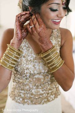 Lovely indian bride getting ready for wedding ceremony bride bangles,bridal tikka,indian wedding mehndi