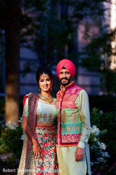 Indian sikh bride and groom in fabulous sangeet outfits. Indian sikh bride and groom in fabulous sangeet outfits.