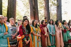 Indian couple guests having fun at sangeet ceremony indian bridesmaids’ fashion,outdoor photography,pre-wedding ceremony photography