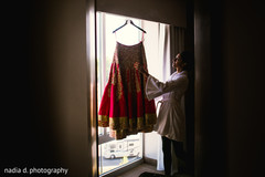Bride admiring her wedding lengha. indian bride,indian bridal lengha,indian bridal fashions