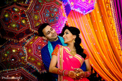Happy indian couple photography at sangeet ceremony outdoor indian wedding decor,indian bridal jewelry,lightning