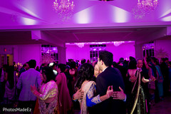 Indian couple having a great time at wedding reception lightning,indian wedding photography,indian wedding gallery