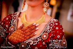 Indian bride showing her mehndi art and jewelry Indian bride showing her mehndi art and jewelry