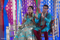 Indian bride and groom enjoying their sangeet night. Indian bride and groom enjoying their sangeet night.