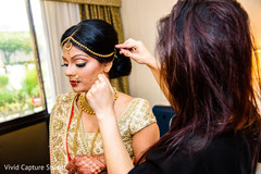 Indian beauty preparing her bridal look. Indian beauty preparing her bridal look.
