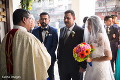 Priest welcoming the bride Priest welcoming the bride
