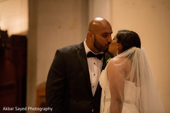 Indian couple kissing at wedding ceremony Indian couple kissing at wedding ceremony