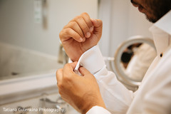 Groom adjusting his cufflinks. Groom adjusting his cufflinks.