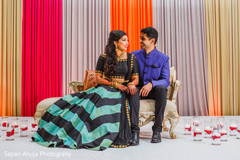 Lovebirds posing on their sangeet stage. Lovebirds posing on their sangeet stage.