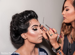 Pretty bride getting her makeup done. Pretty bride getting her makeup done.