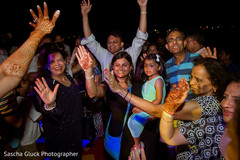 Wedding guests enjoying the welcome party. destination wedding photography,dj and entertainment,indian pre-wedding celebrations