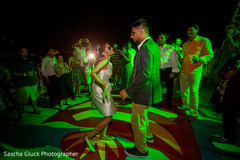 Bride and groom dancing at their wedding welcome party. destination wedding photography,dj and entertainment,indian pre-wedding celebrations