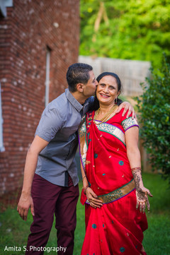 Groom kissing his mother Groom kissing his mother