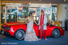 Great shot of indian couple with luxury car Great shot of indian couple with luxury car