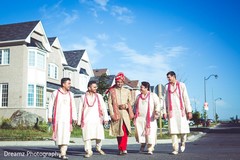 Indian groom walking with his groomsmen Indian groom walking with his groomsmen