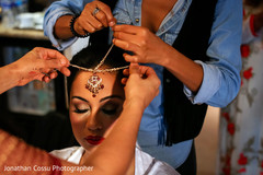 Indian bride's tikka. indian bride getting ready,indian bride,indian bridal jewelry
